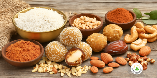 A plate of date and nut energy balls rolled in shredded coconut and crushed nuts.
